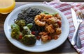 Black spaghetti with shrimp tomato sauce and baked broccoli with Roquefort cheese. Orange juice