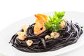 Black spaghetti with shrimps isolated