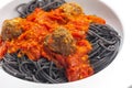 black spaghetti with tomato sauce with meat balls Royalty Free Stock Photo
