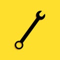 Black Spanner icon isolated on yellow background. Long shadow style. Vector