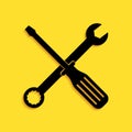 Black Spanner and screwdriver tools icon isolated on yellow background. Service tool symbol. Long shadow style. Vector