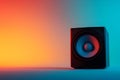 A black speaker is sitting on a table Royalty Free Stock Photo