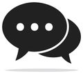 Black speech bubbles icon representing communication messaging or online conversation with ellipsis dots Royalty Free Stock Photo