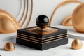 Black sphere on a gold and black platform with abstract white and gold background Royalty Free Stock Photo