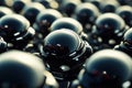 Black spherical objects arranged closely together create a striking visual composition Royalty Free Stock Photo