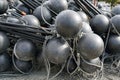 Black spherical plastic floats of fishing nets