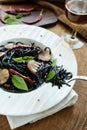 Black spicy spaghetti with sausage and chilli Royalty Free Stock Photo