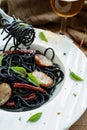 Black spicy spaghetti with sausage and chilli Royalty Free Stock Photo