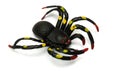 A black spider Halloween toy with patches of bright yellow at its eight legs Royalty Free Stock Photo