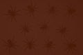 Black spiders on a dark red background, gradient background and silhouettes of spiders, festive scary background