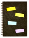 Black spiral note book and post it