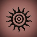 A black spiraled sun symbol with wavy rays on a brown textured background. The design Royalty Free Stock Photo