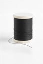 Black spool has shadow on white background. Royalty Free Stock Photo
