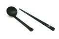 Black spoon and chopsticks isolated Royalty Free Stock Photo