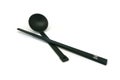 Black spoon and chopsticks isolated Royalty Free Stock Photo