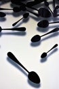 Black spoons on white background Royalty Free Stock Photo