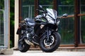 Black sport bike Kawasaki Ninja in the rain