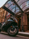 Black sportbike at the entrance to the hotel