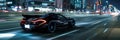 Black sports car speeds down night city street with blurred lights Royalty Free Stock Photo