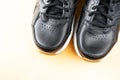 Black sports leather sneakers close up.