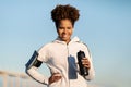 Black Sporty Female With Fitness Water Bottle In Hands Standing Outdoors