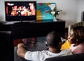 Black spouse watching movie enjoy precious time together