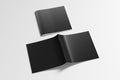 Black square brochure or booklet cover mock up on white. Closed one brochure and upside down other. Clipping path around brochure. Royalty Free Stock Photo