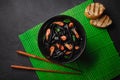 Black squid ink Fettuccine pasta with prawns or shrimps , parsley, chili in wine and butter sauce Royalty Free Stock Photo