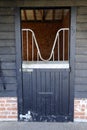 Black stable door, at equine barn.