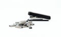Black stapler and metal staple isolated on a white background. Office Equipment and Work Tool concept