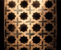 Black stars and crosses on tile mosaic panel with traditional patterns, made in 16th century, Spain