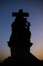 Black Statue along the North side of Charles Bridge