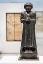 Black statue of a manin the Louvre Lens