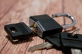 Black steel padlock with keys on a wooden background. Concept of security and tranquility Royalty Free Stock Photo