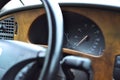 black steering wheel and speedometer in the car