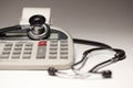 Black Stethoscope on Calculator Royalty Free Stock Photo