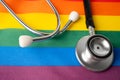 Black stethoscope on rainbow background, symbol of LGBT pride month celebrate annual in June, social, of gay, lesbian, bisexual,