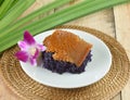 Black sticky rice with steamed custard on wooden background Royalty Free Stock Photo