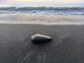 Black stone, black sand, volcanic beach of Saint Paul, Zen background Royalty Free Stock Photo