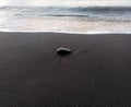 Black stone, black sand, volcanic beach of Saint Paul, Zen background Royalty Free Stock Photo