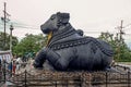 Black stone Nandi bull sits on Chamundi Hill way to Chmudi temple