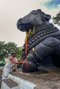 Black stone Nandi bull sits on Chamundi Hill way to Chmudi temple