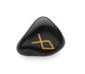 Black stone rune Othila isolated on white Royalty Free Stock Photo