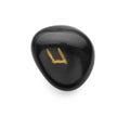 Black stone rune Uruz isolated on white Royalty Free Stock Photo