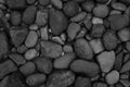 Black stone, Shiny black lava pebbles on the beach, Black lava pebble stone Royalty Free Stock Photo