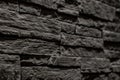 Black stone slate texture background, slate stone wall. decorative tiles for wall decoration. Black brick. loft decor style. Royalty Free Stock Photo