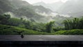 A black stone tabletop with a view of the tea plantations, surrounded by green mountains and clouds Royalty Free Stock Photo