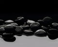 Black stones on calm water Royalty Free Stock Photo