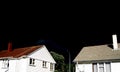 Black Stormy Sky Two houses Royalty Free Stock Photo