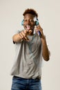 Black student man with headphones and mobile phone listening to music dancing and singing Royalty Free Stock Photo